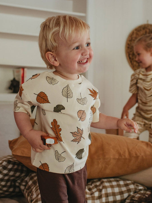 child wearing autumn leaf organic short sleeve tee