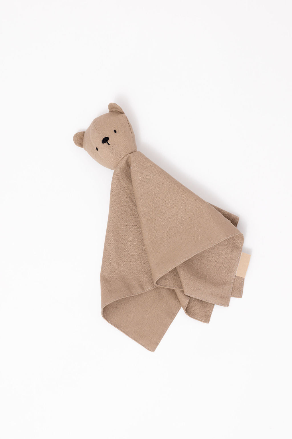 Beige bear-shaped towel on a white background