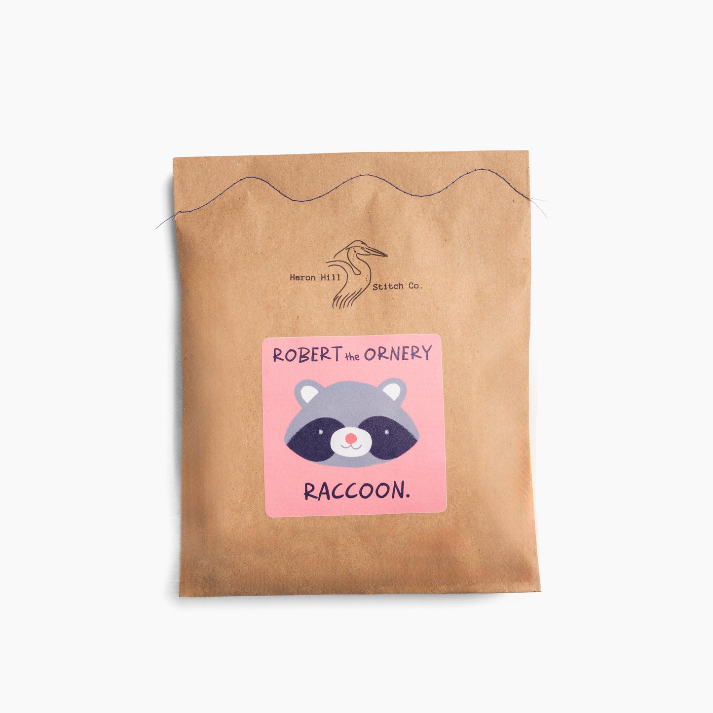 Kraft paper pouch with a raccoon illustration and text on a white background