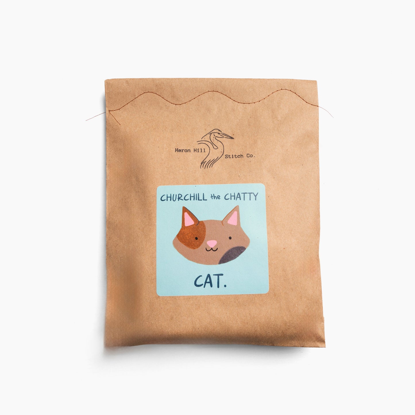 Kraft paper pouch with a cat illustration and text on a white background