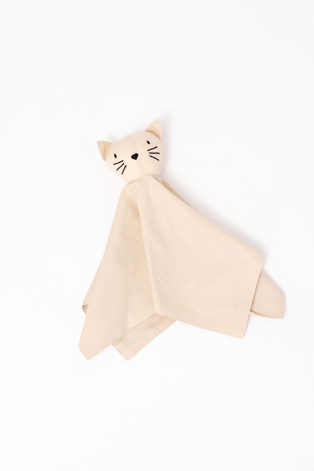Cat-shaped plush toy with a soft beige blanket on a white background
