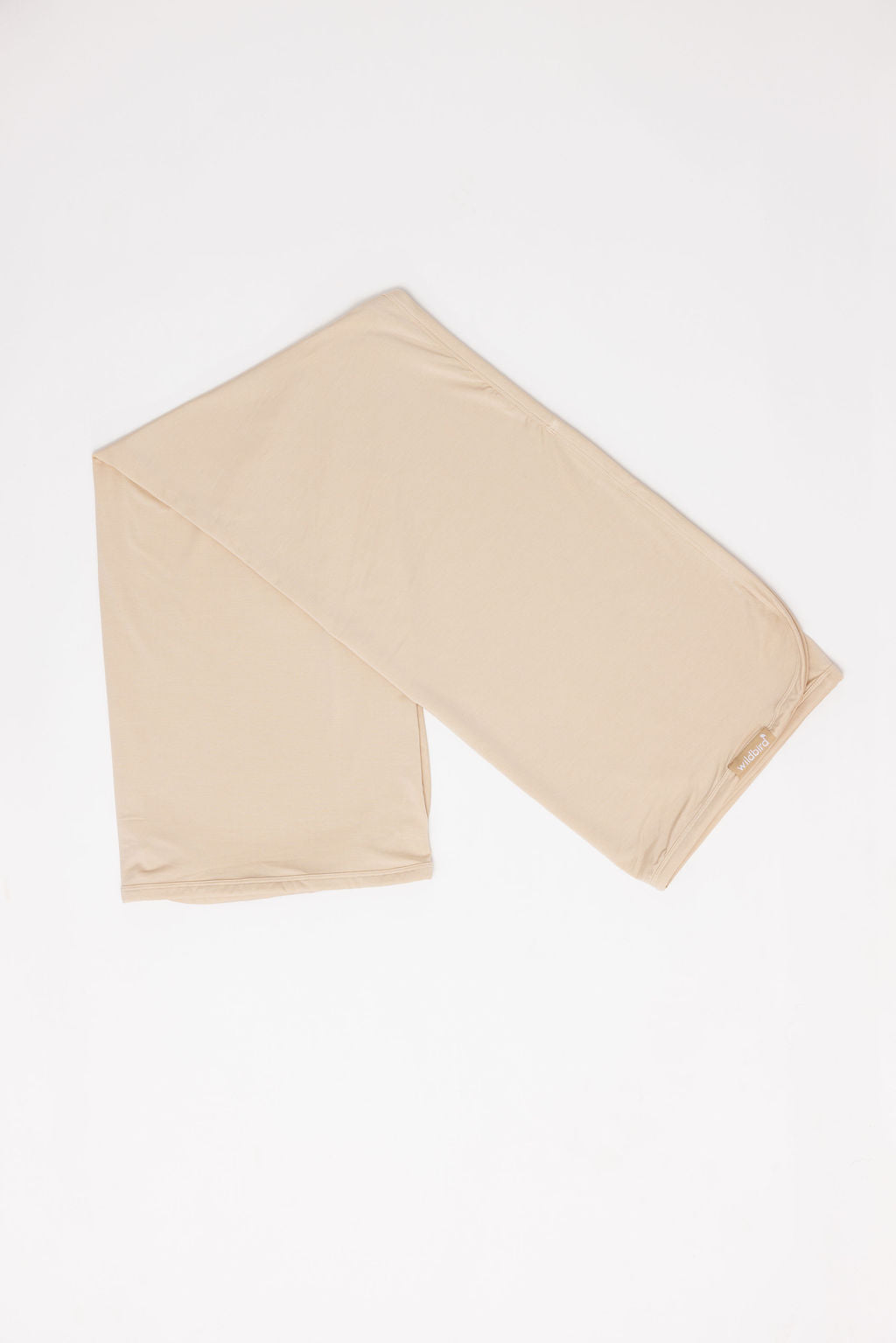 Beige fabric folded on a white background