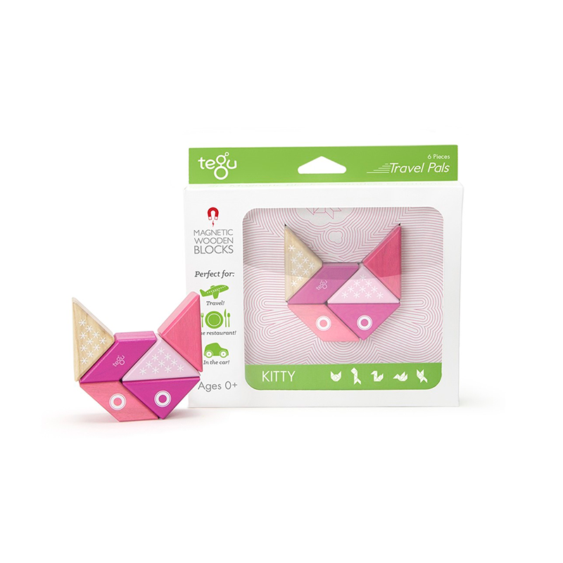 Tegu magnetic wooden blocks packaging with pink and gold geometric shapes on a white background