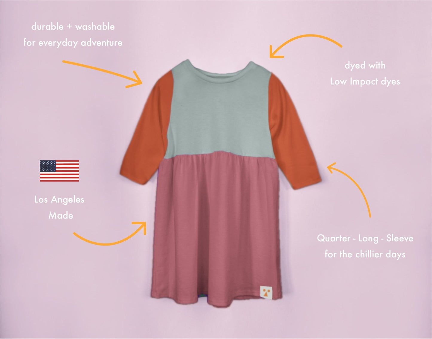 Color-blocked dress with text highlighting features on a light purple background