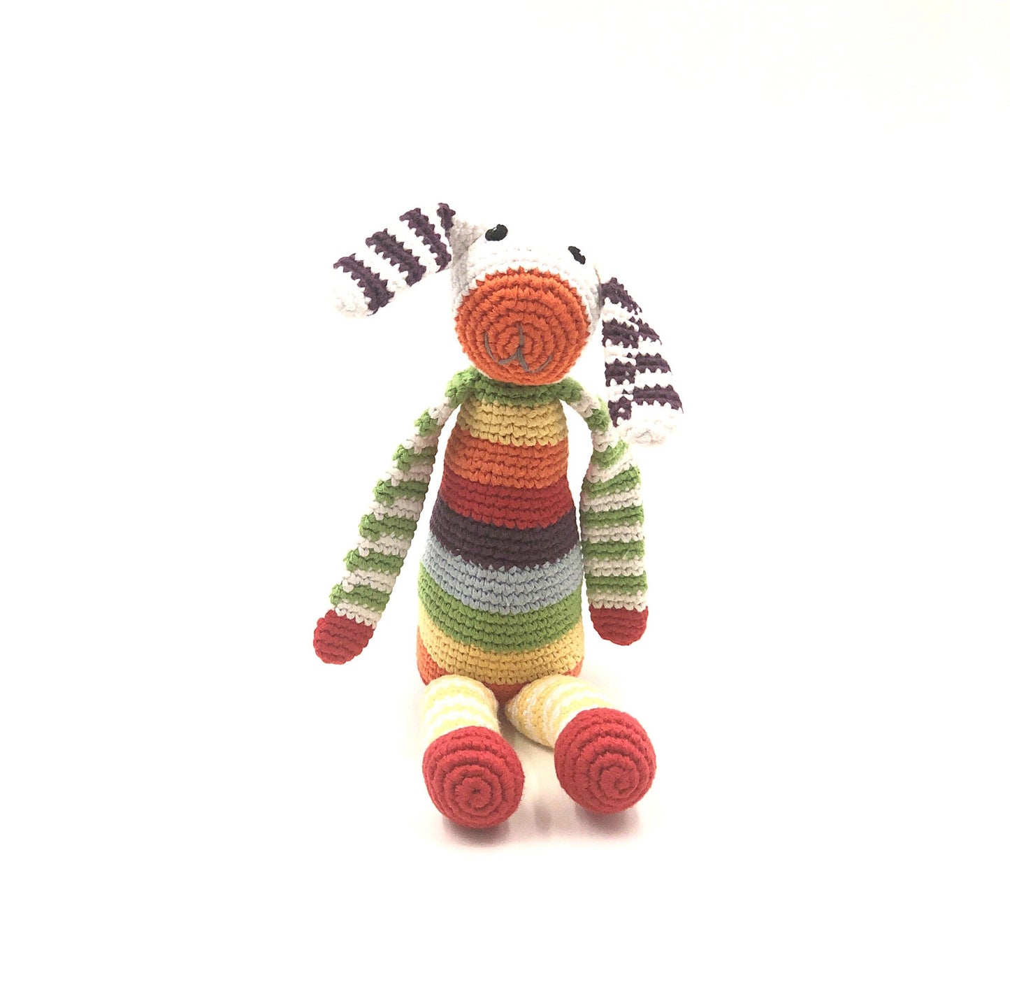 Colorful striped toy zebra on a white background