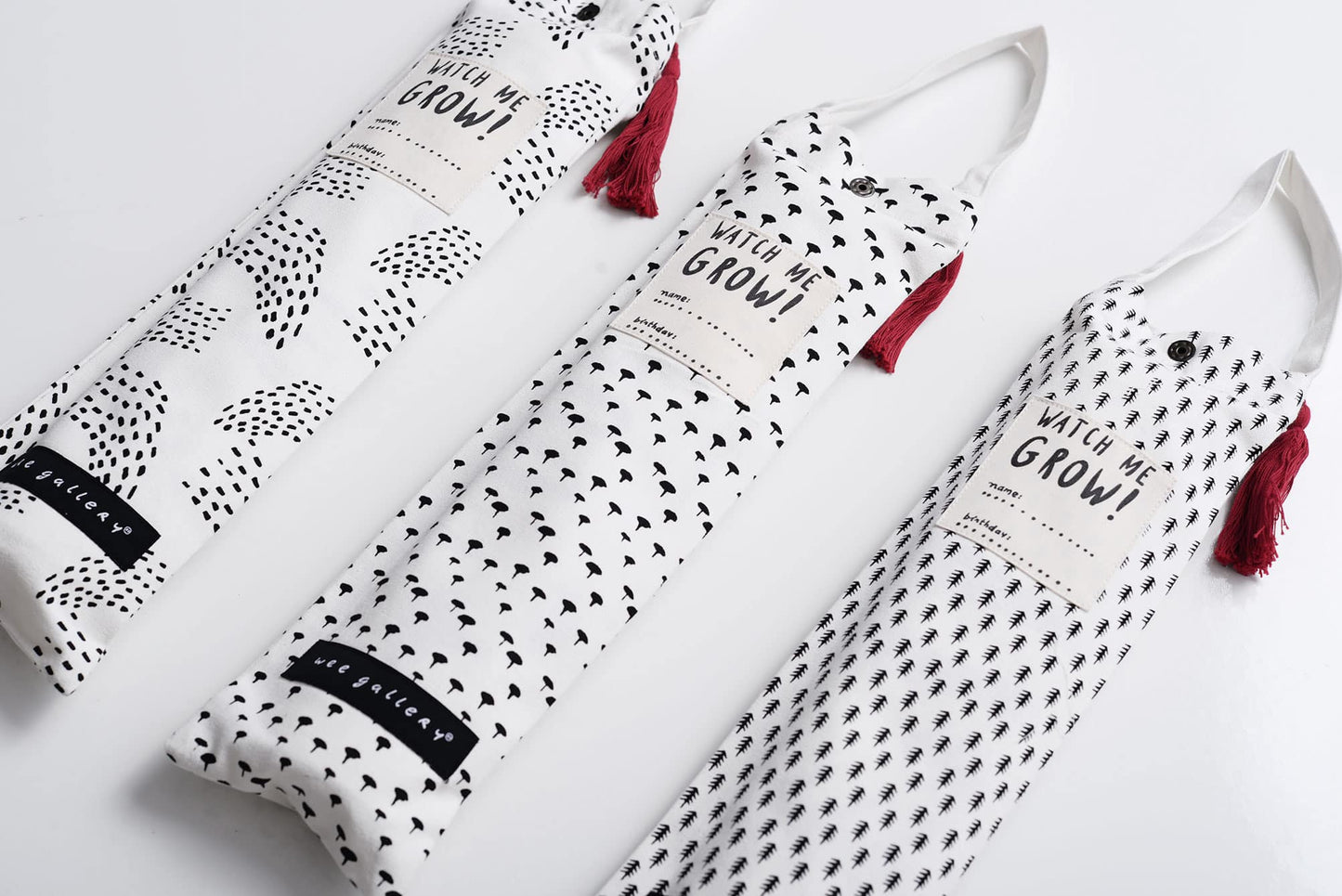 White aprons with black patterns and red tassels on a white background