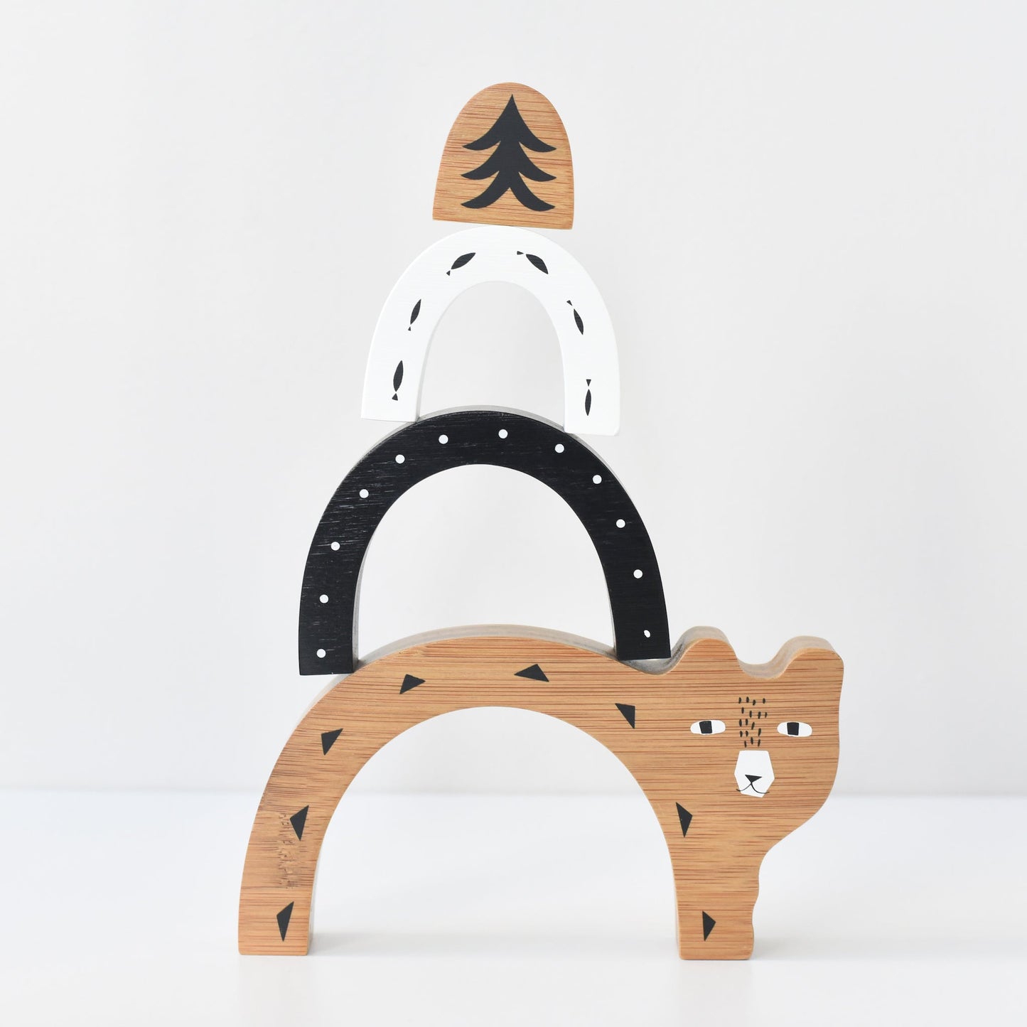 Wooden toy arch with bear design on a white background