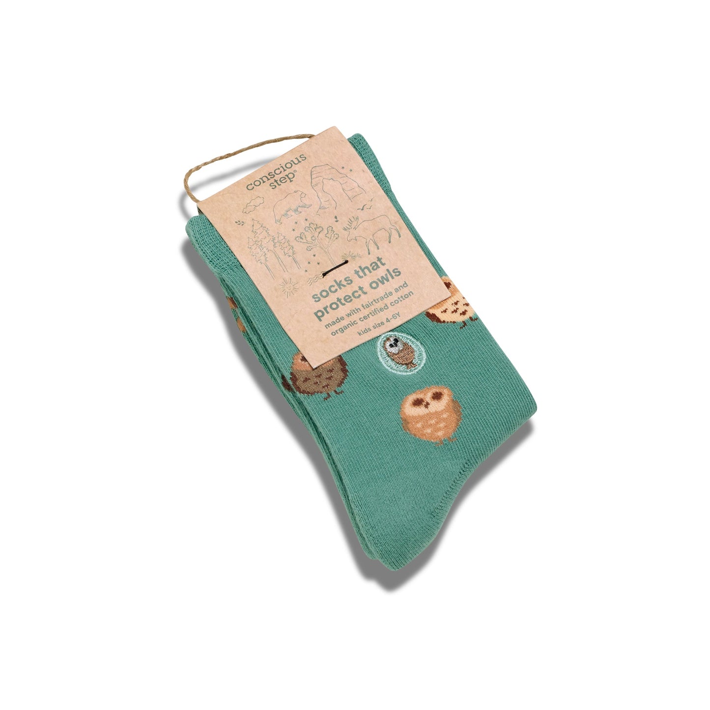 Green socks with owl design and a label on a white background