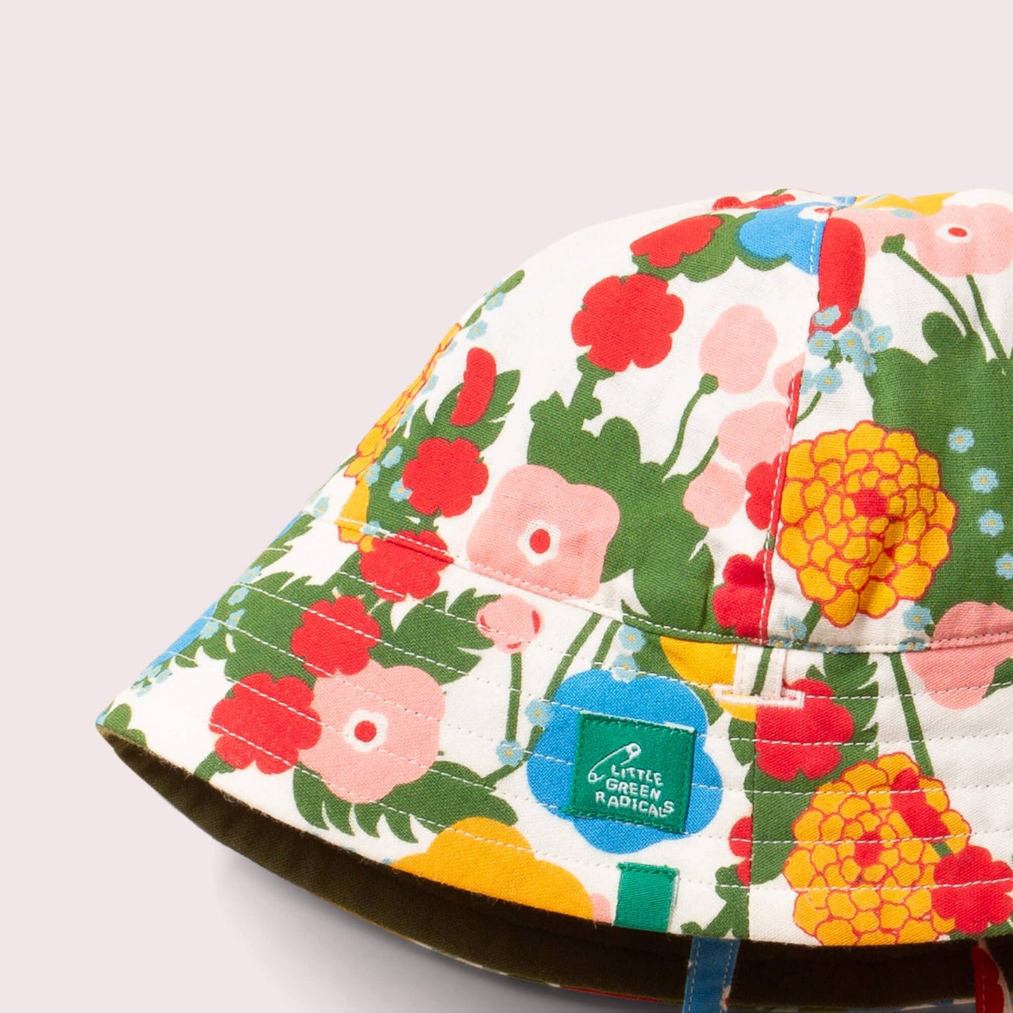Close-up of a floral-patterned bucket hat on a light gray background