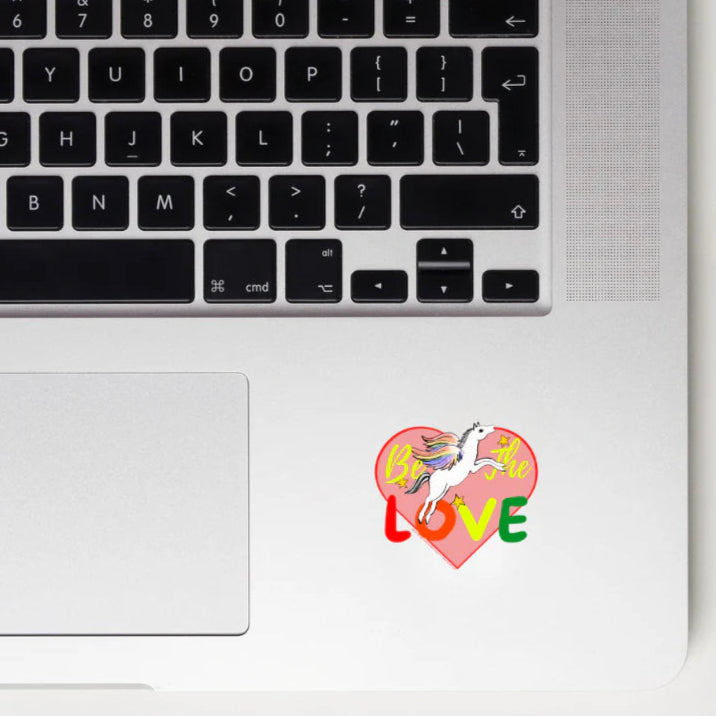 be the love pegasus sticker on a laptop