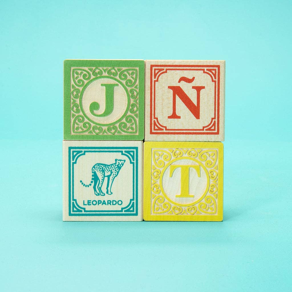 Four colorful blocks with letters and a cheetah illustration on a light blue background