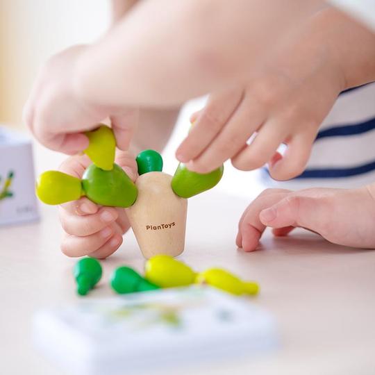 Child Playing PlanMini Balancing Cactus Game