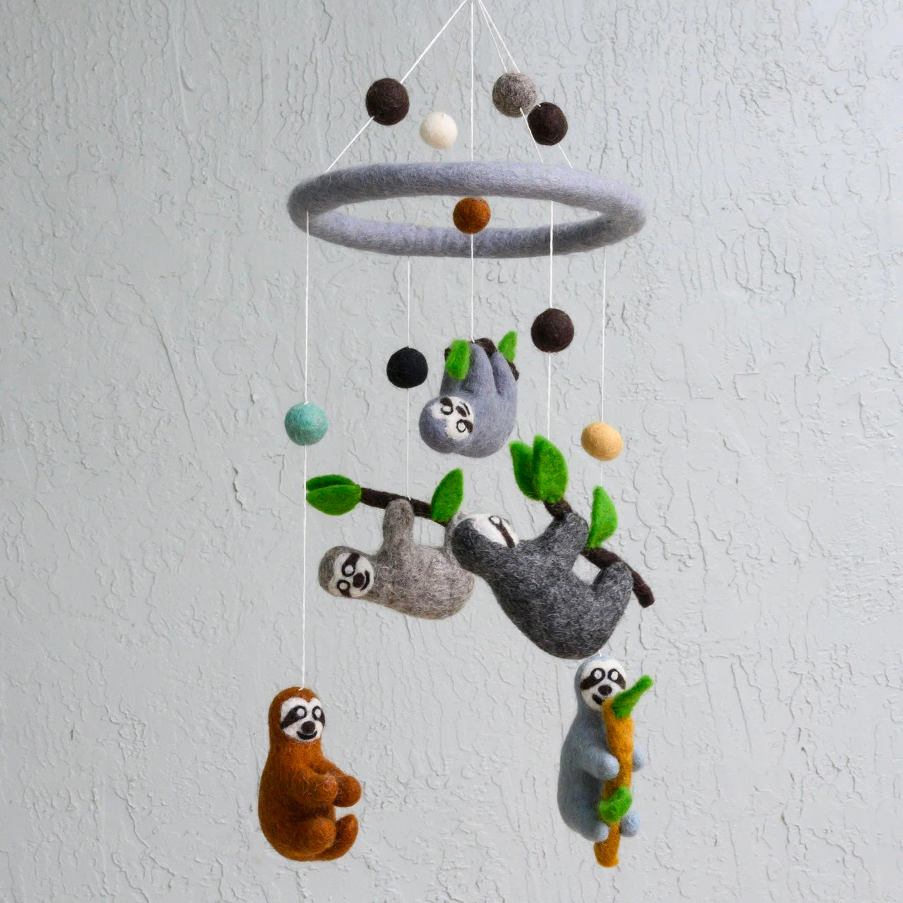 a sloth baby mobile on a white background