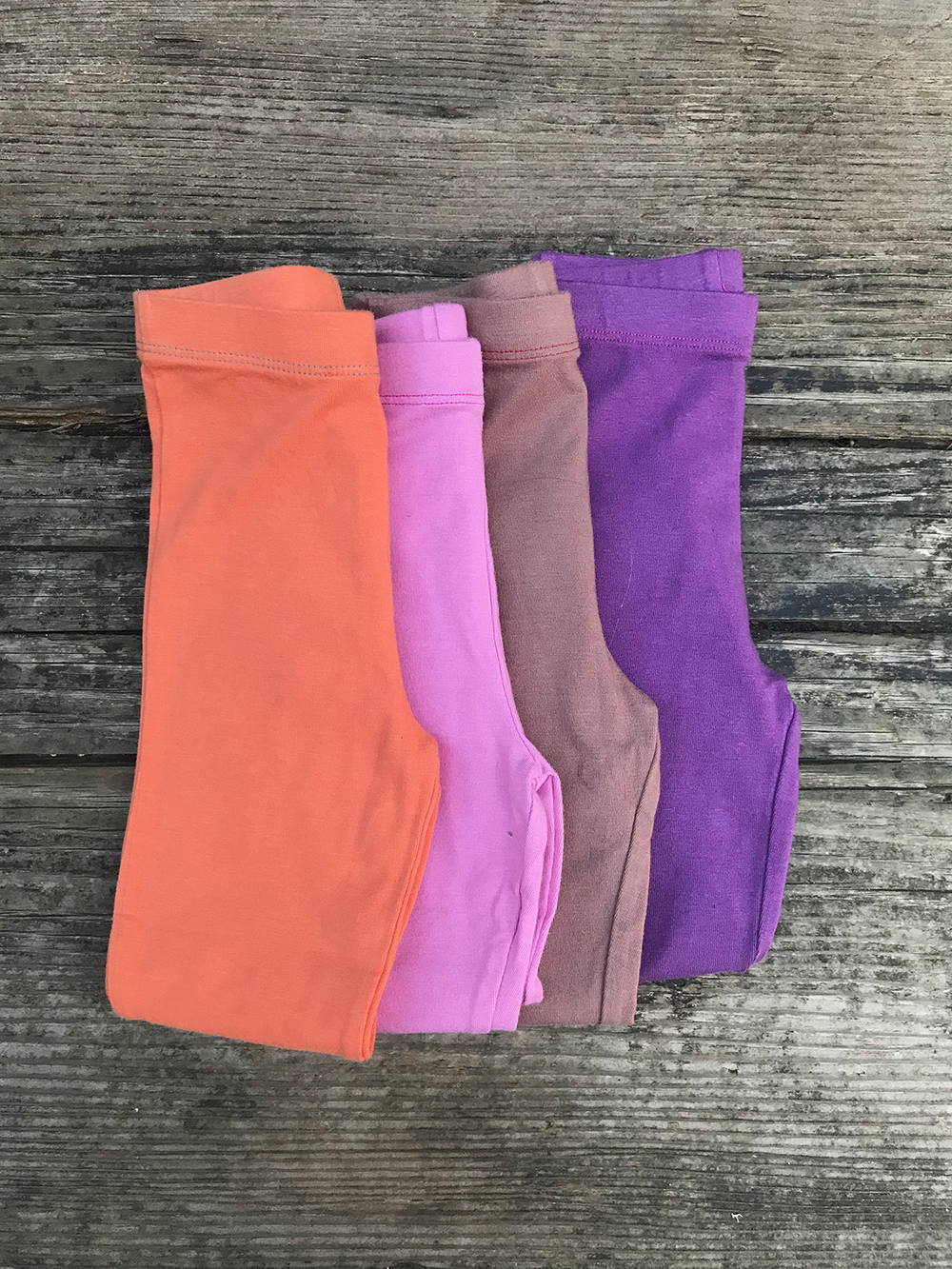 Stack of organic baby leggings