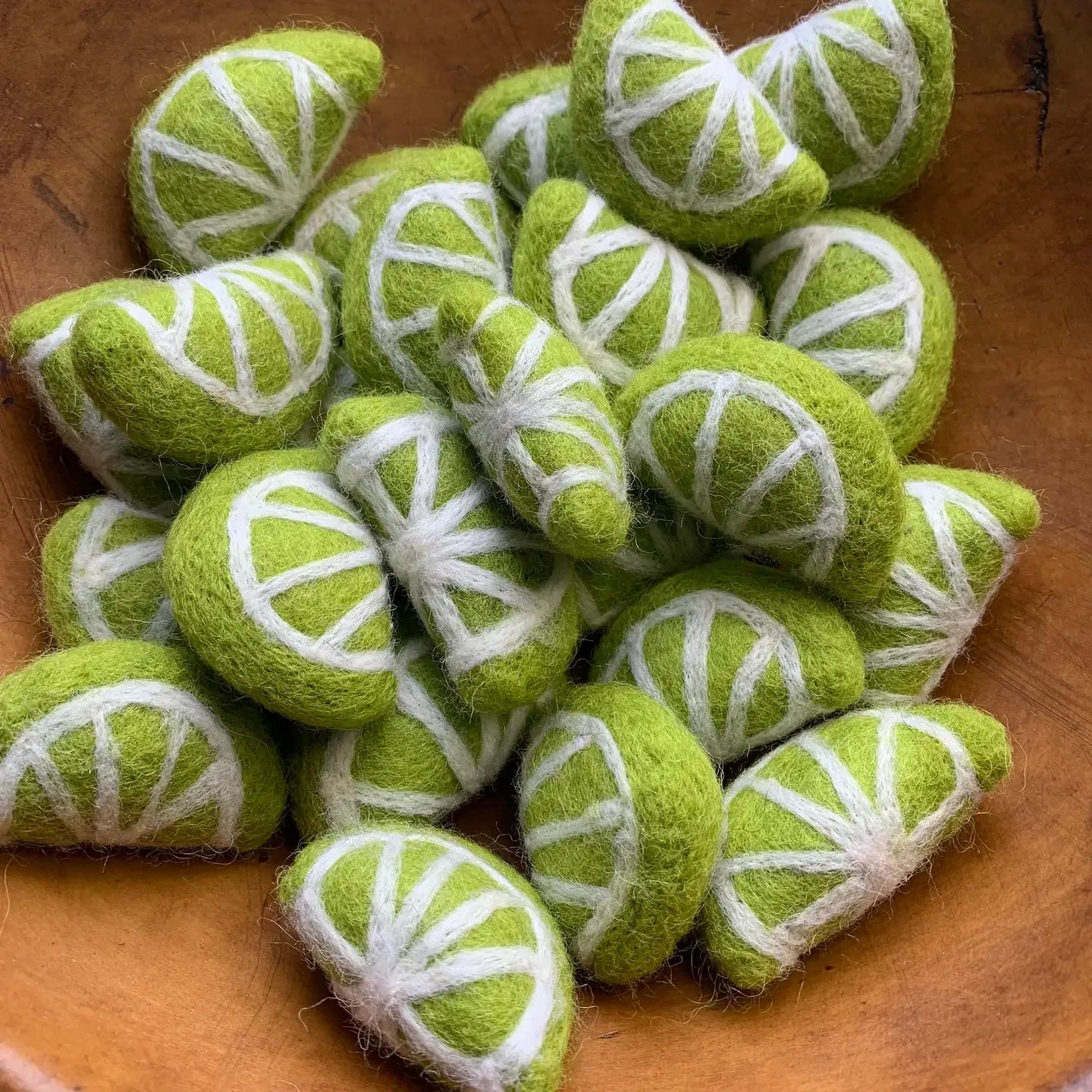 a bunch of felt lime slices