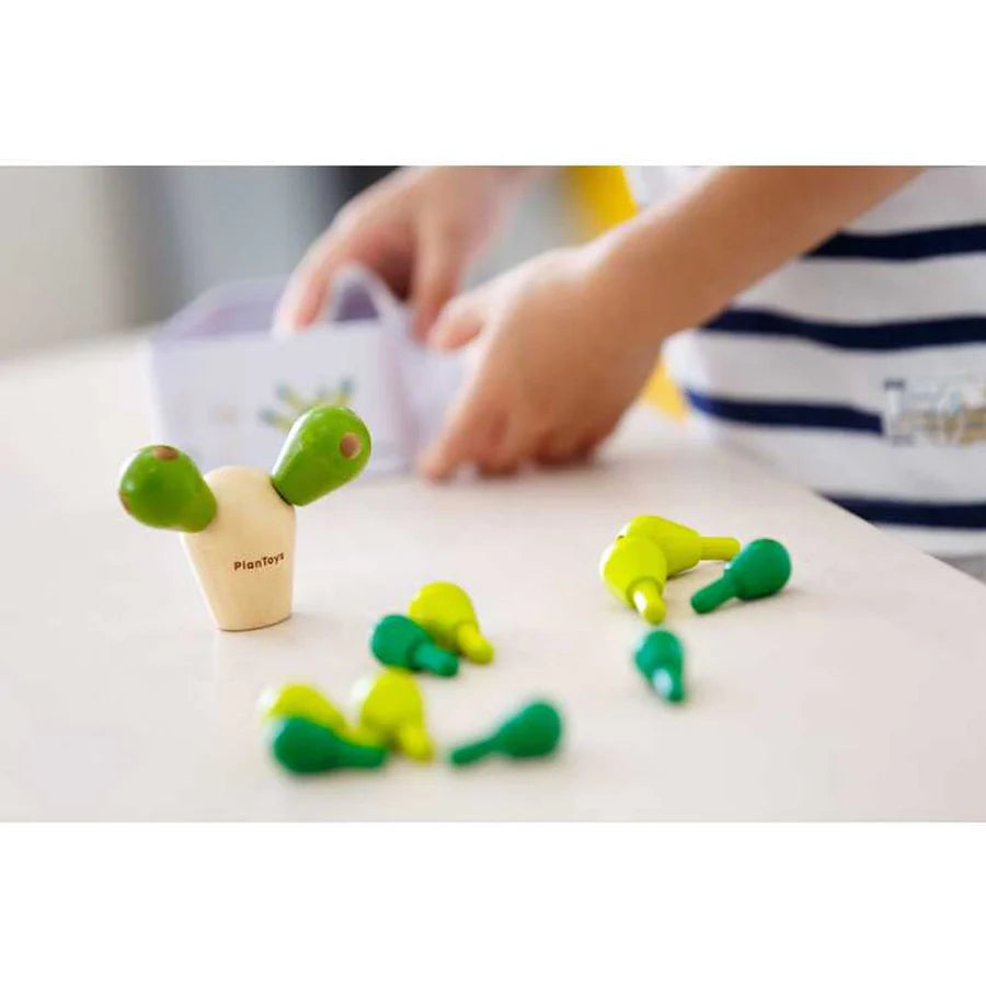 child playing with PlanMini Balancing Cactus Game