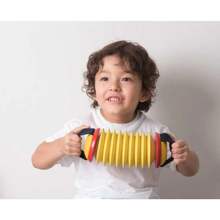 Child playing with Concertina by PlanToys
