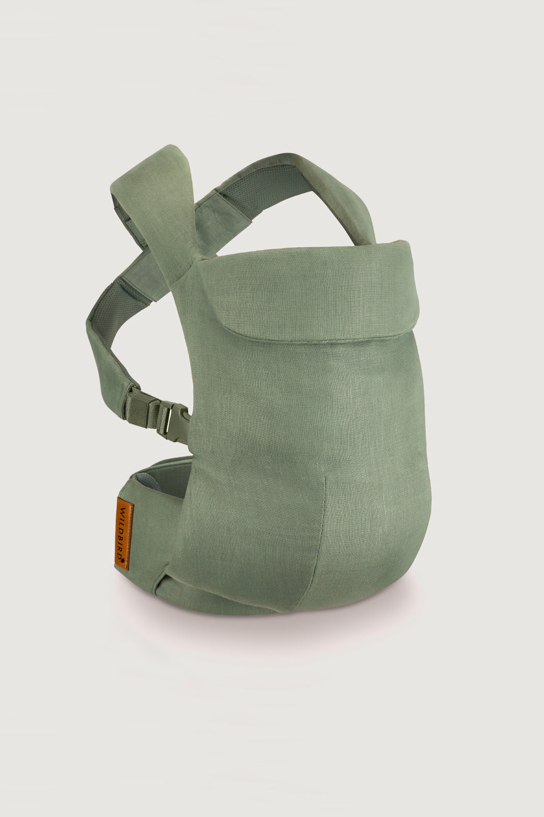 Green baby carrier on a light gray background