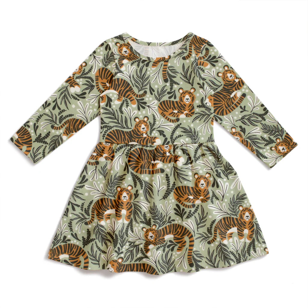 Children's dress with tiger and green leaves pattern on a white background