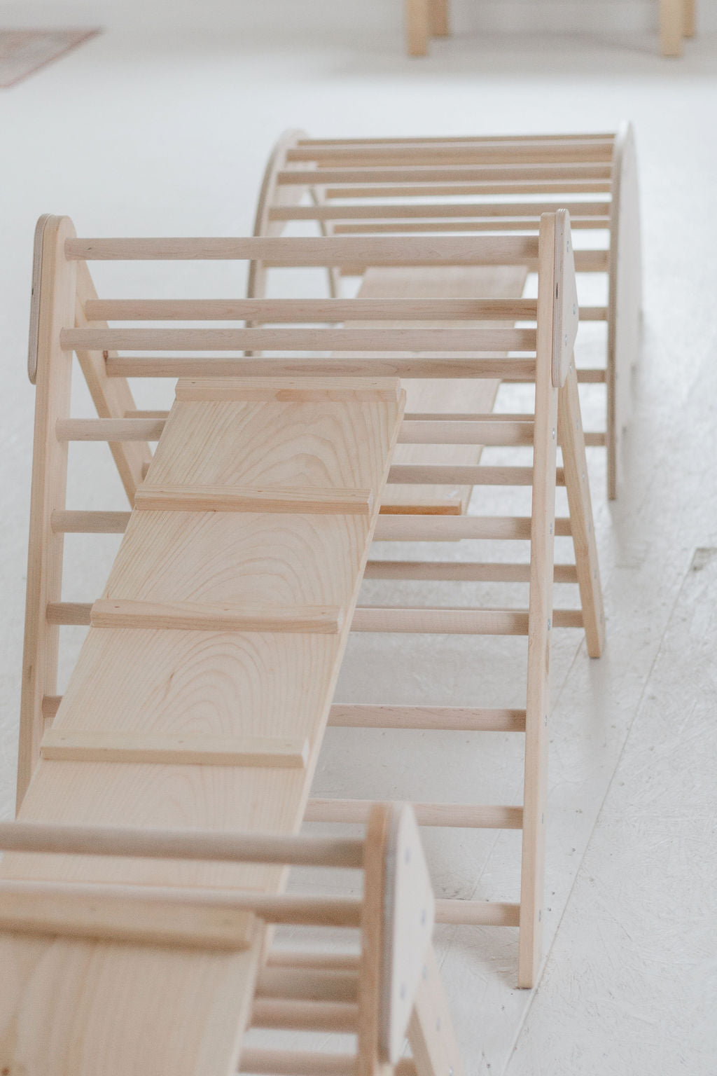 Wooden pet stairs on a white floor