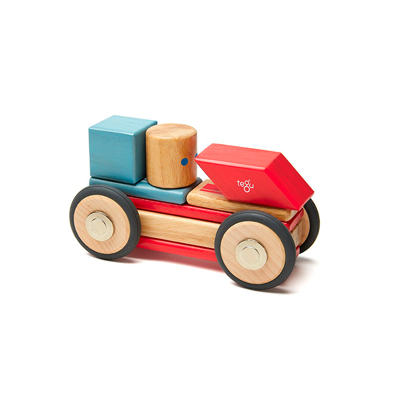 Colorful wooden toy truck with blocks on a white background