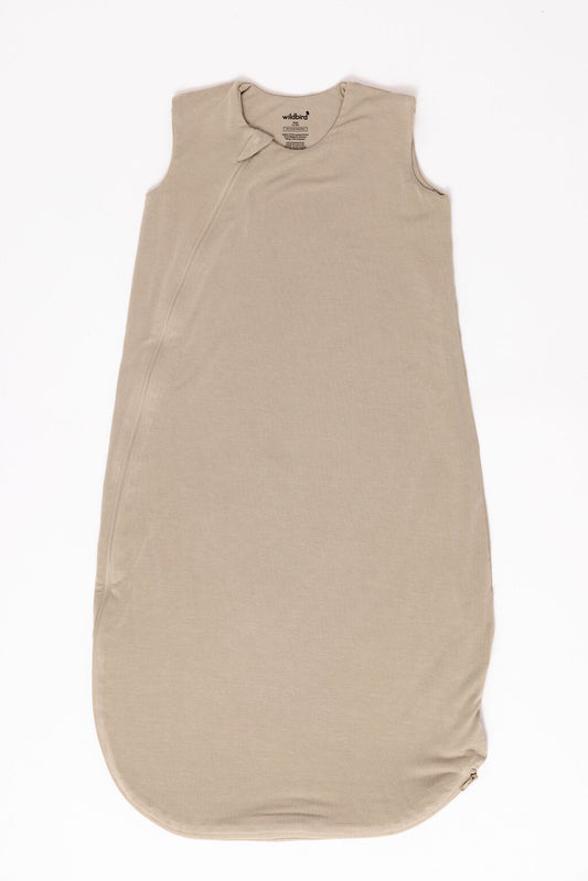 Beige baby sleeping bag on a white background