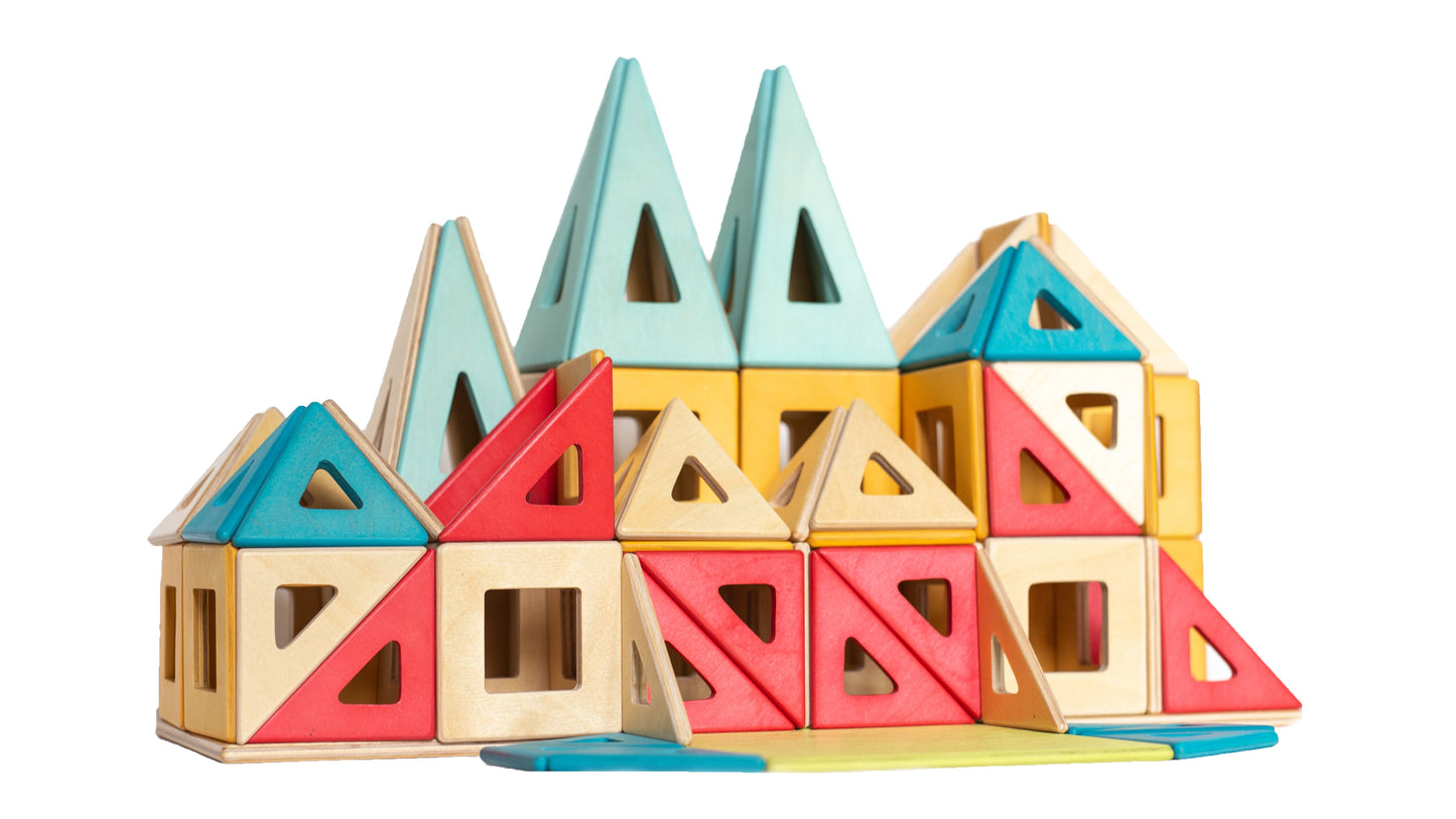 Colorful geometric wooden building blocks on a white background