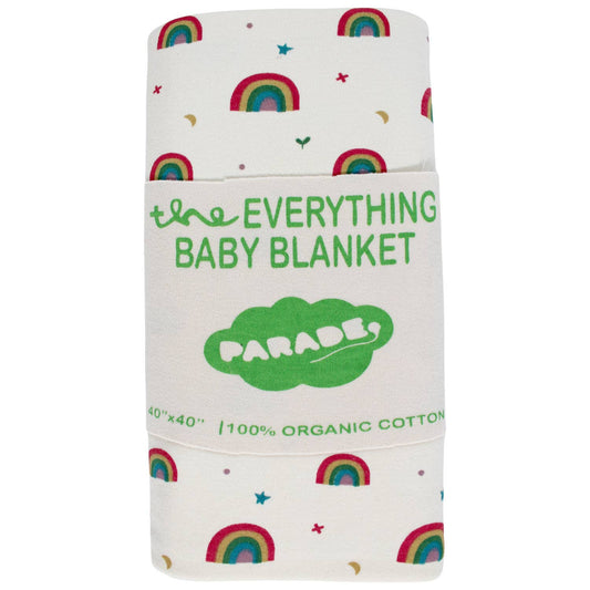 Everything  Rainbows Organic Baby Blanket, a while blanket with hand printed rainbows  accented with multi colored  tiny stars and moons rolled up with a label in the 