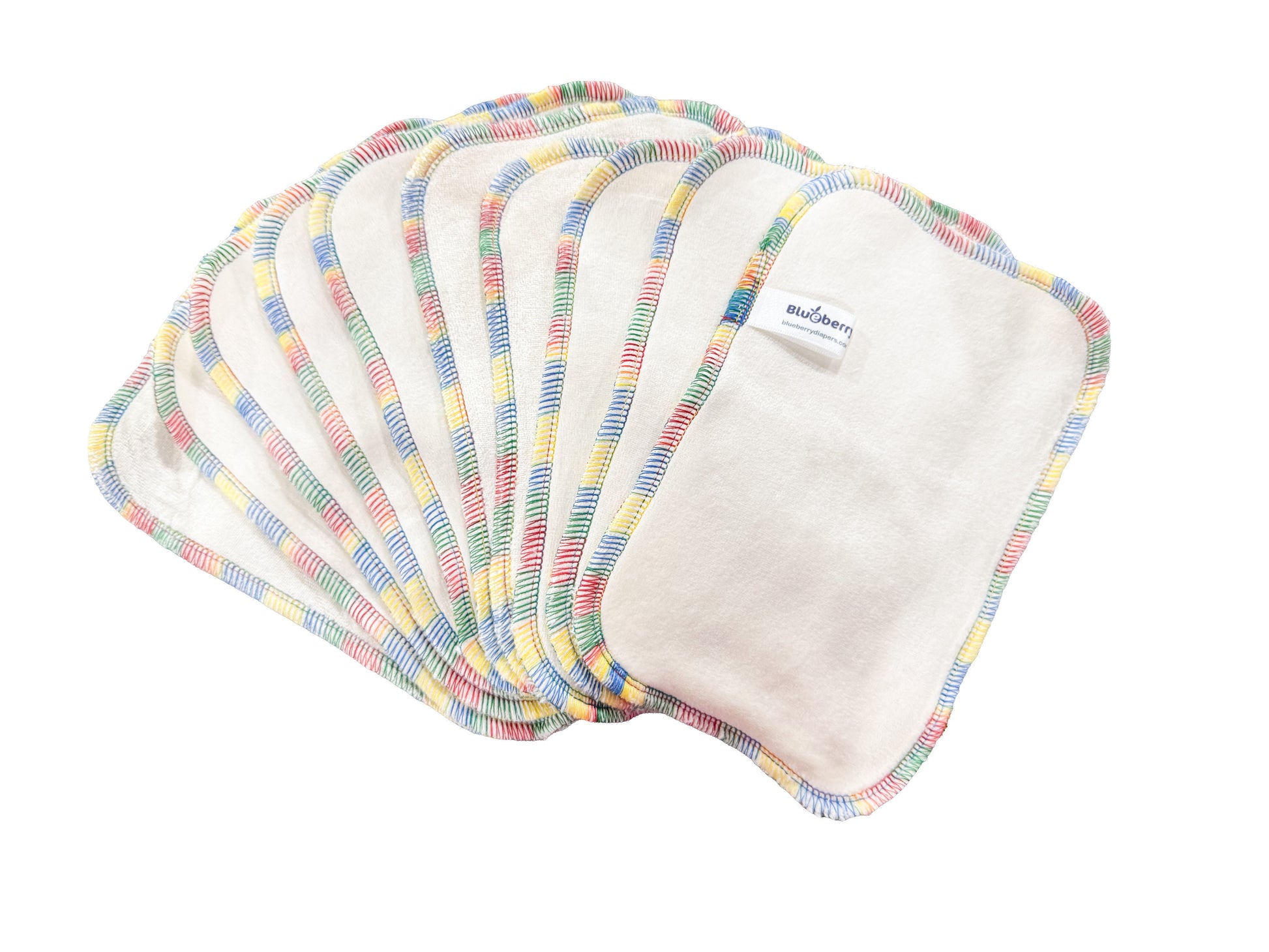 Set of cloth pads with colorful trim on a white background