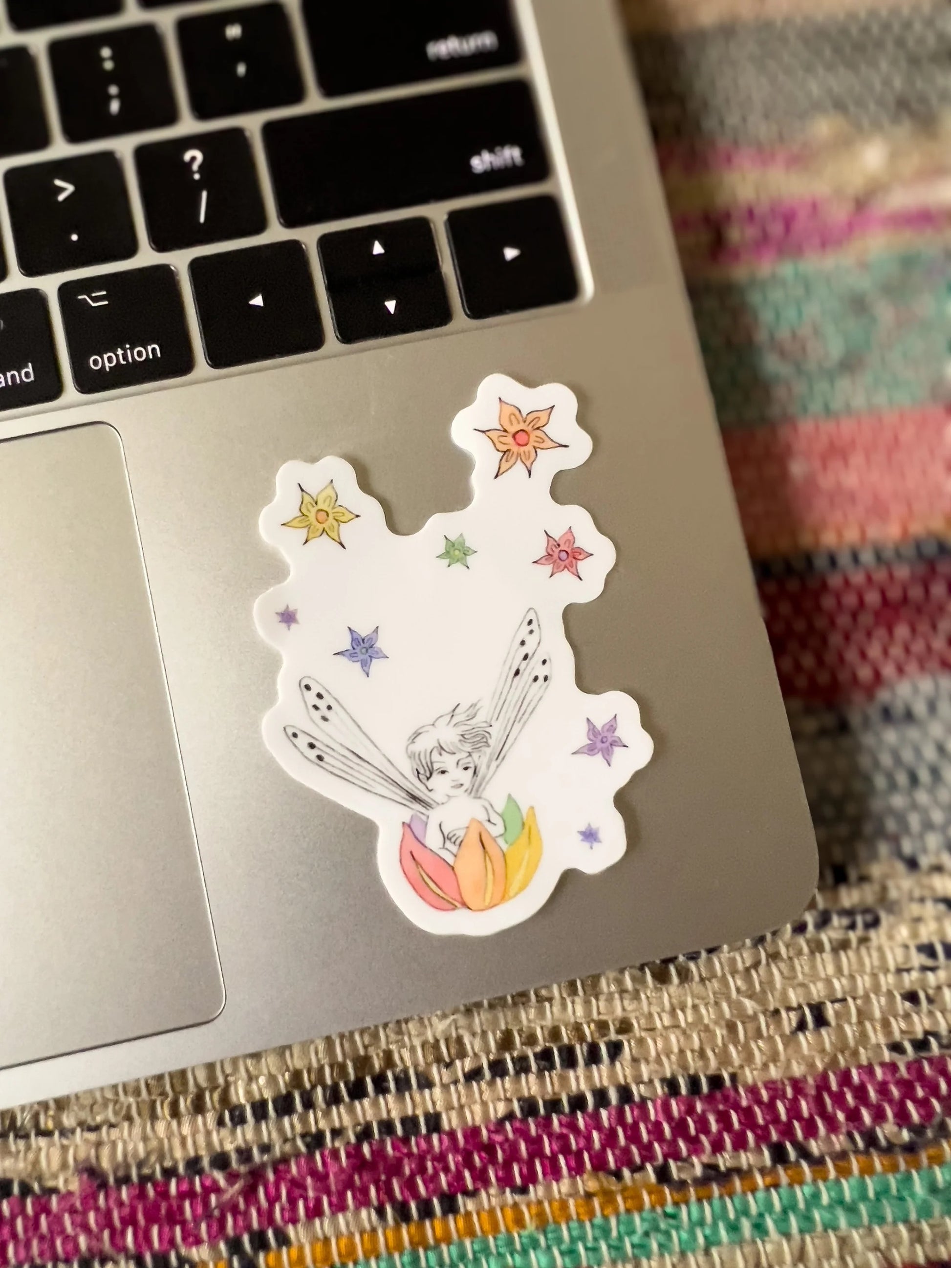 rainbow fairy boat sticker on a laptop