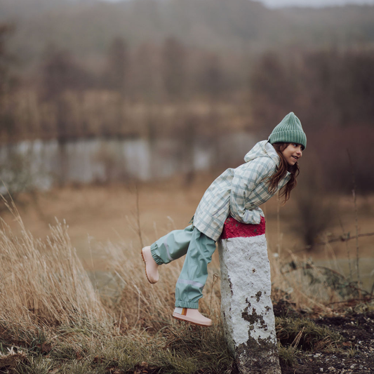 Person in a forest setting with a blurred background