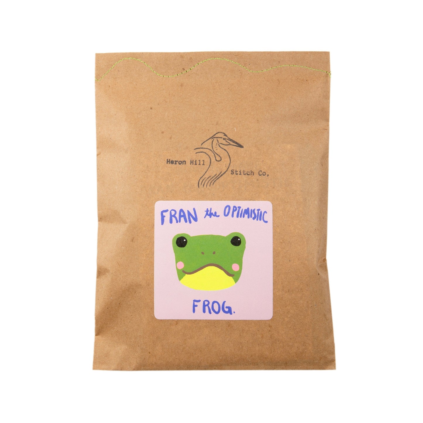 Kraft paper package with a frog illustration and text on a white background
