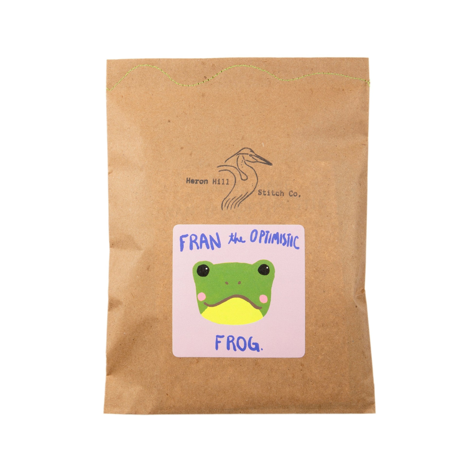 Kraft paper package with a frog illustration and text on a white background