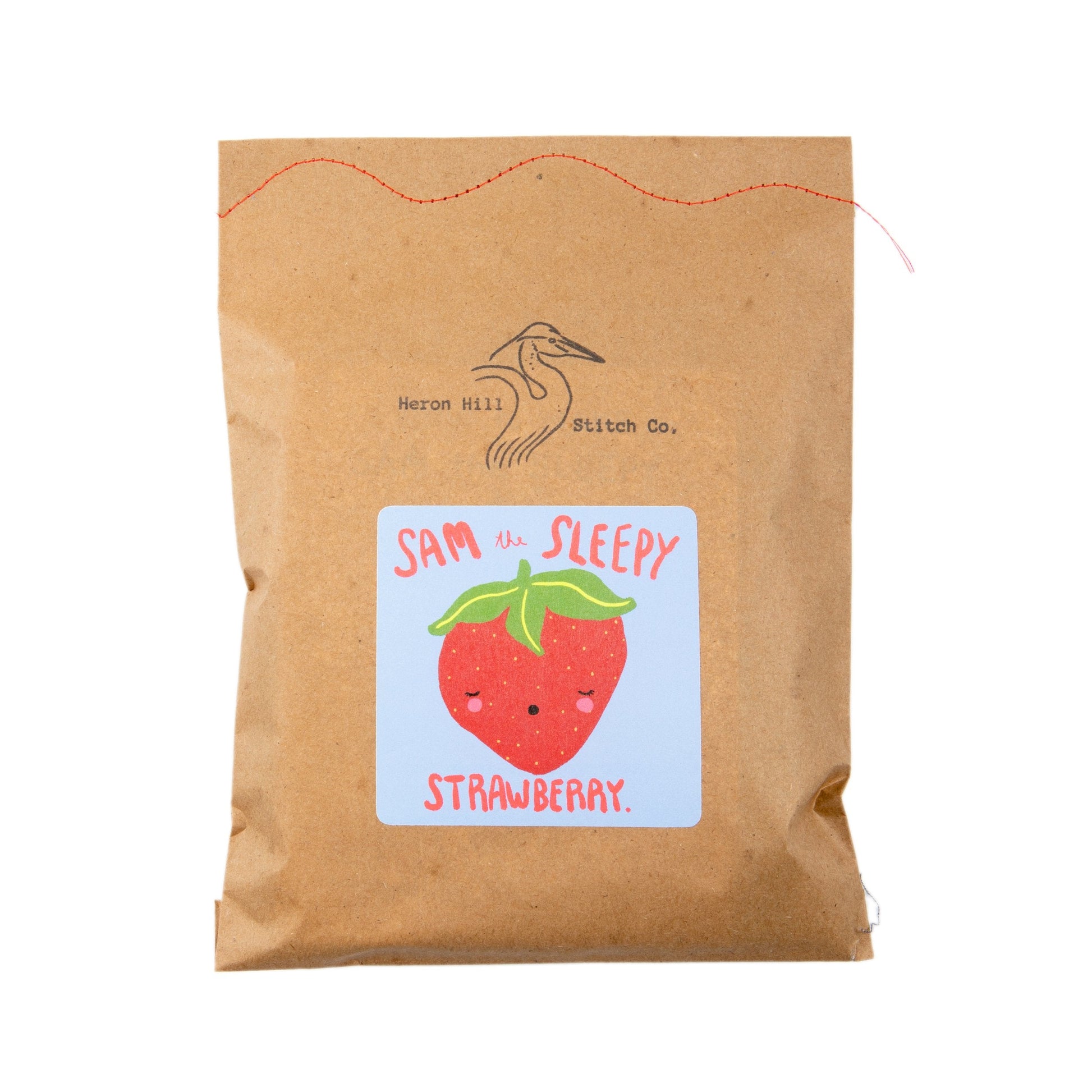 Kraft paper package with a strawberry illustration and text on a white background
