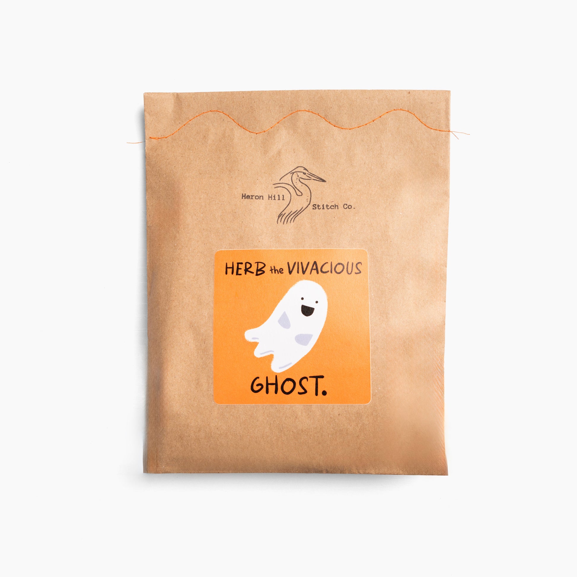 Kraft paper package with a ghost illustration and text on a white background