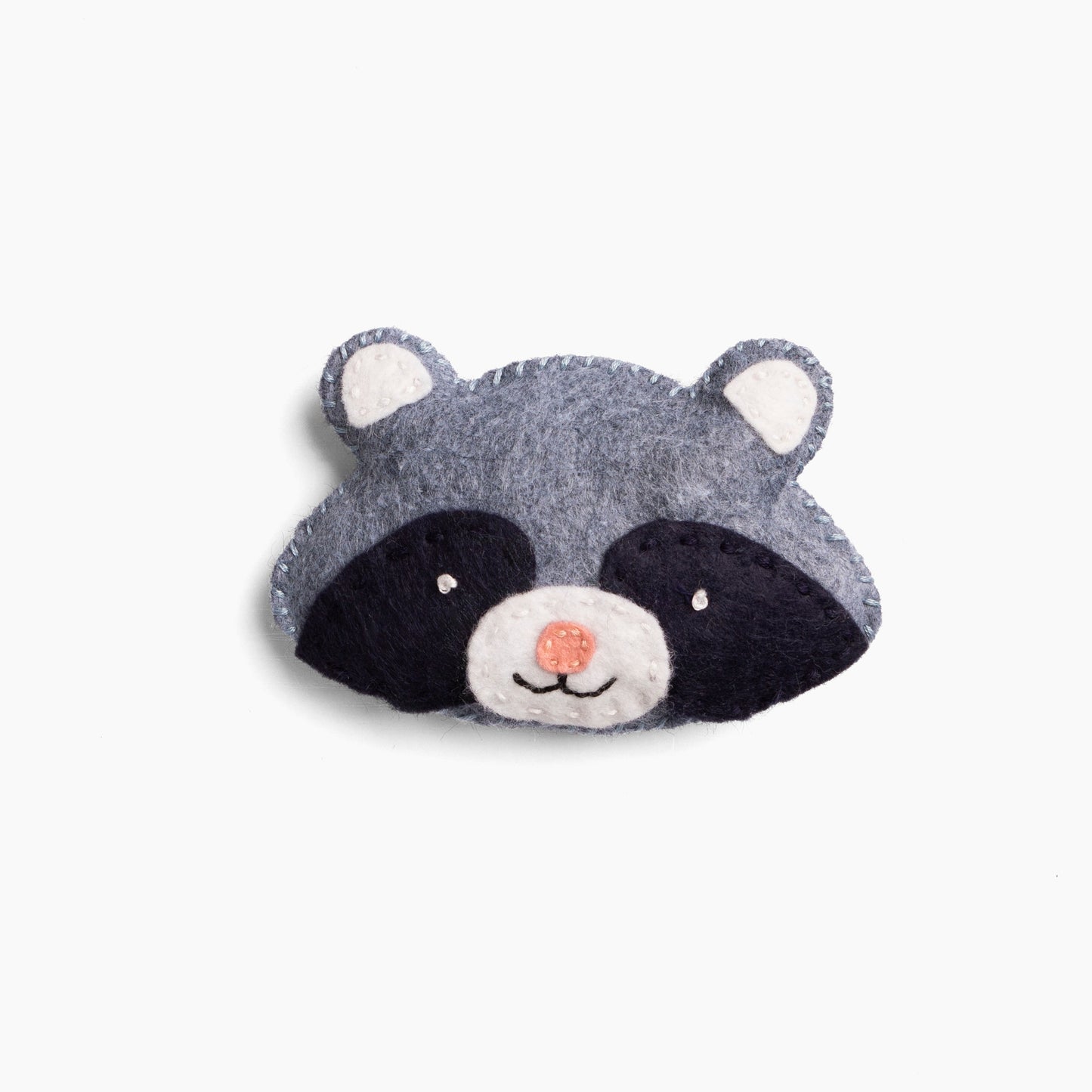 Plush raccoon head toy on a white background