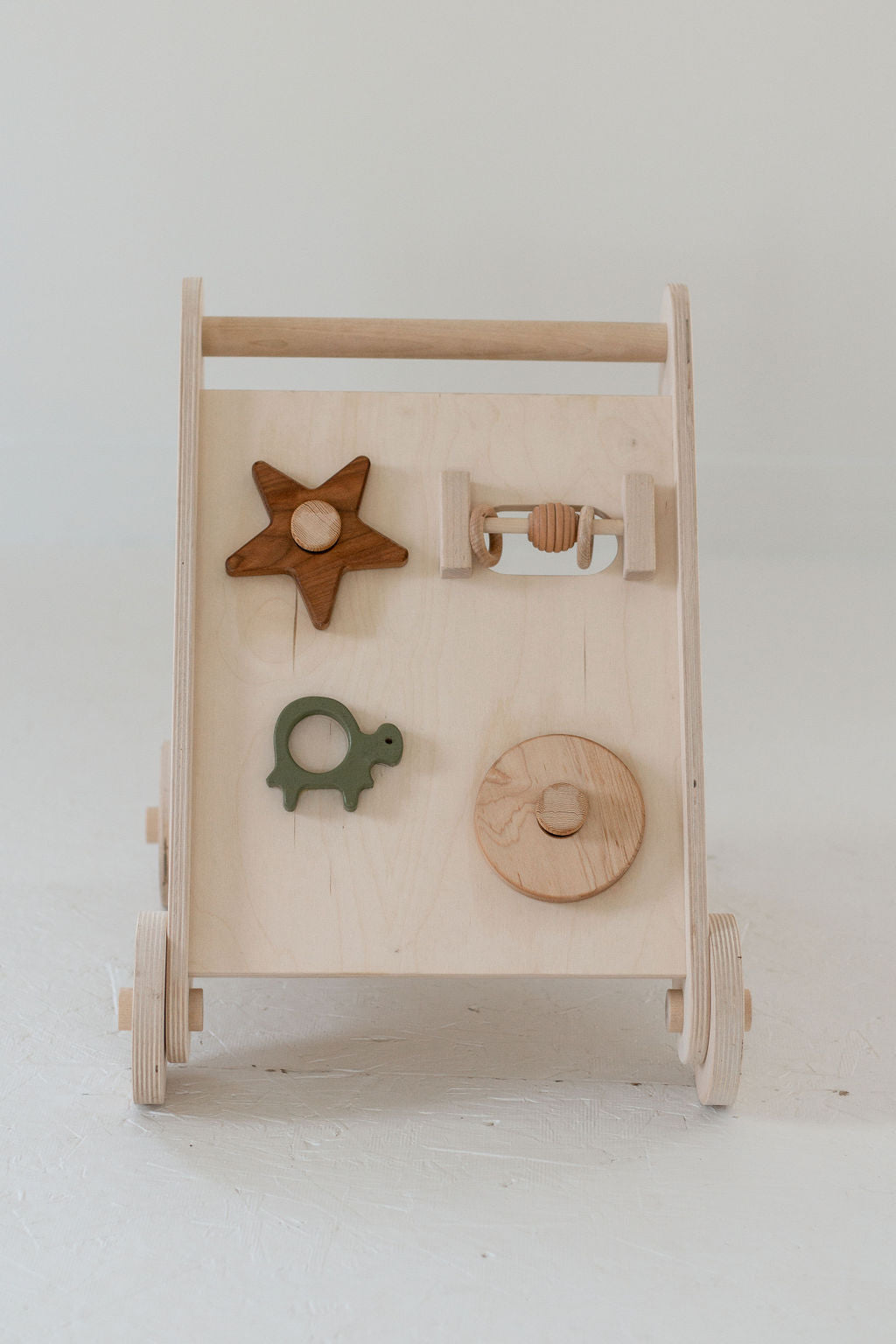 Wooden toy with various shapes on a white background