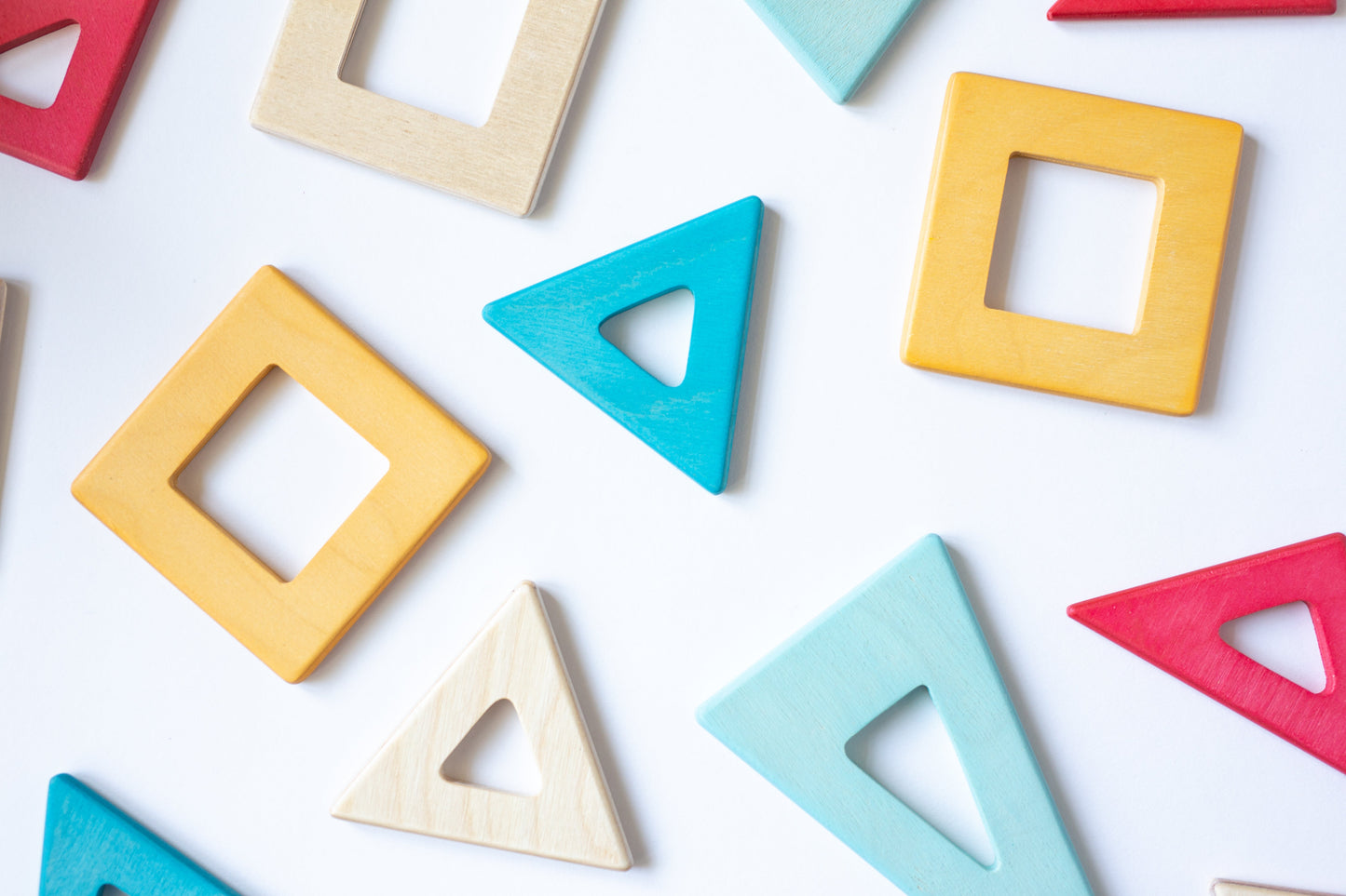 Colorful wooden geometric shapes on a white background