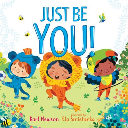 Book cover of 'Just Be You!' with three children in colorful costumes on a floral background.