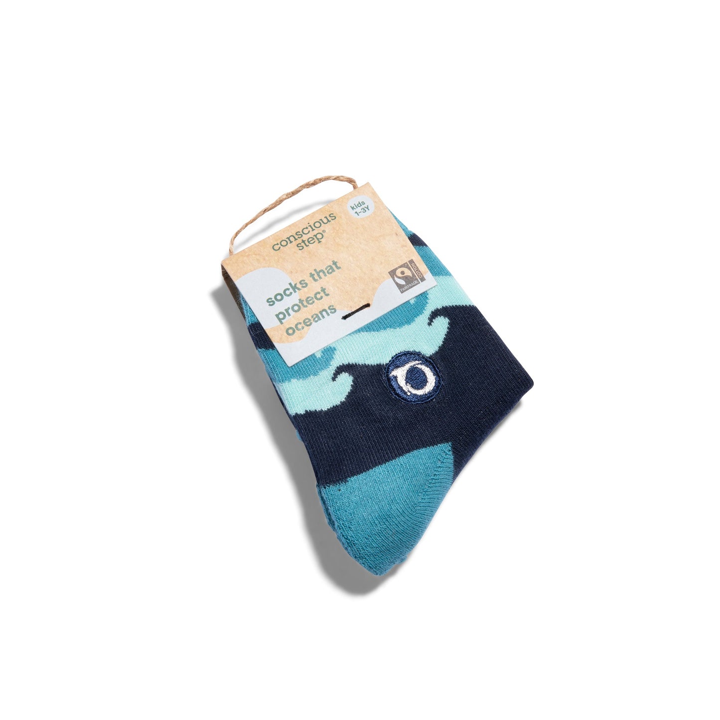 Navy and teal sock with whale design on a white background