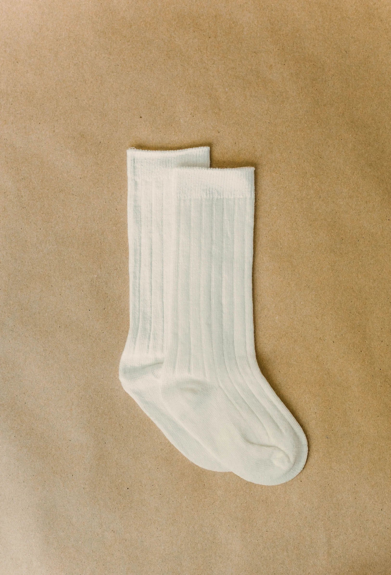 White sock on a beige background