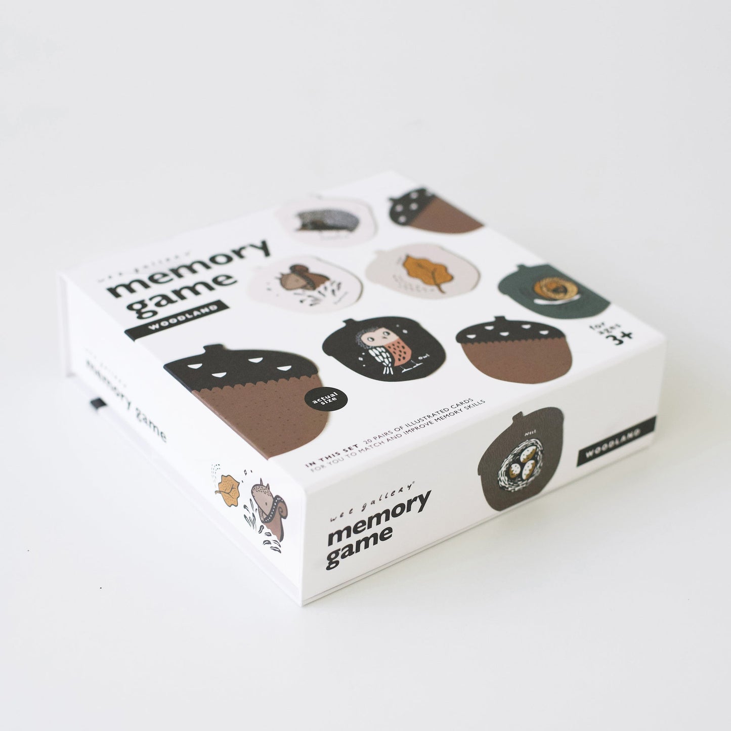 Memory game packaging with acorn illustrations on a white background
