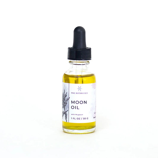Bottle of Moon Oil with a dropper on a white background