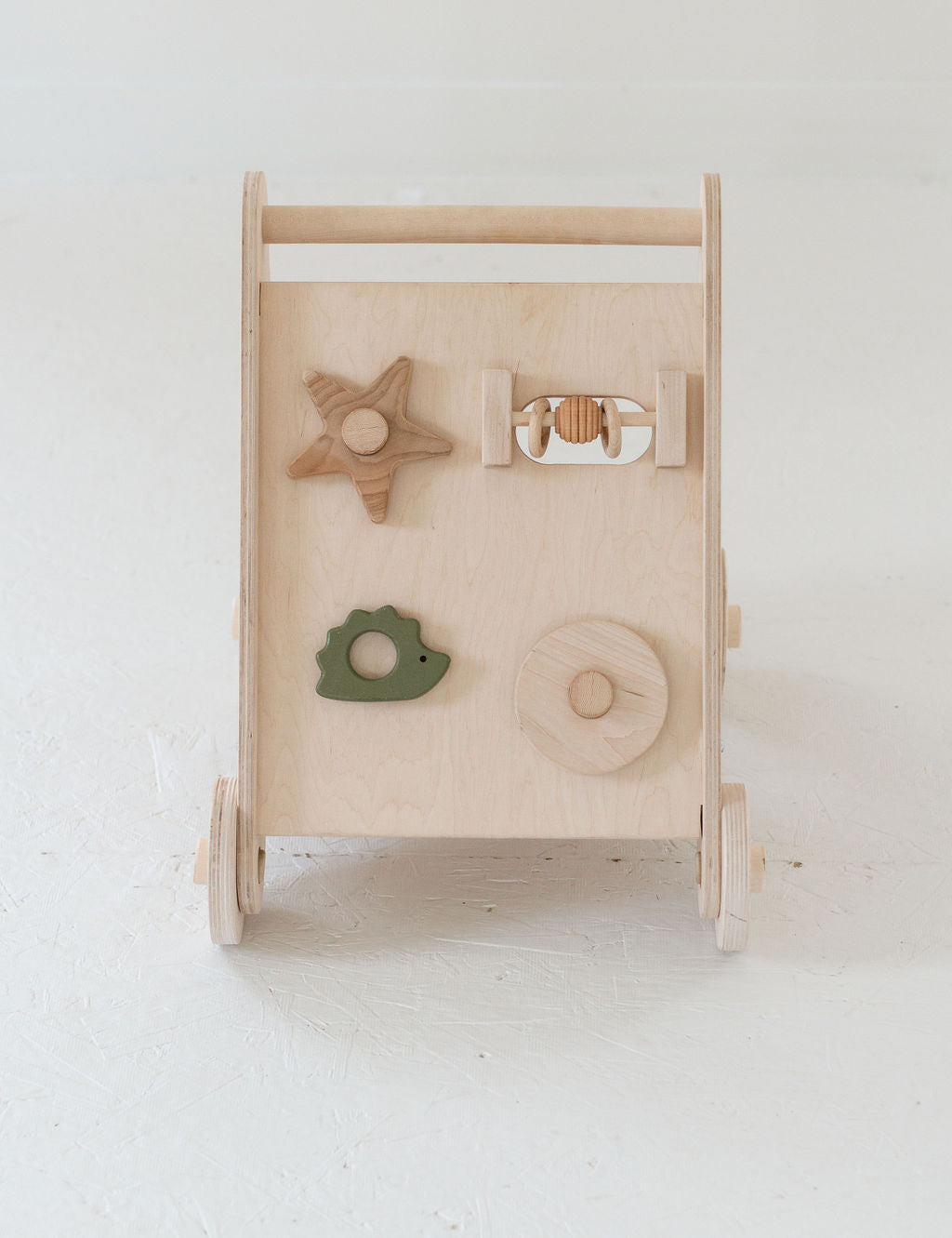 Wooden toy with various shapes on a white background