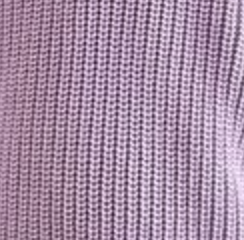 Close-up of a textured purple fabric surface