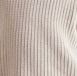 Close-up of a textured fabric with a neutral color palette