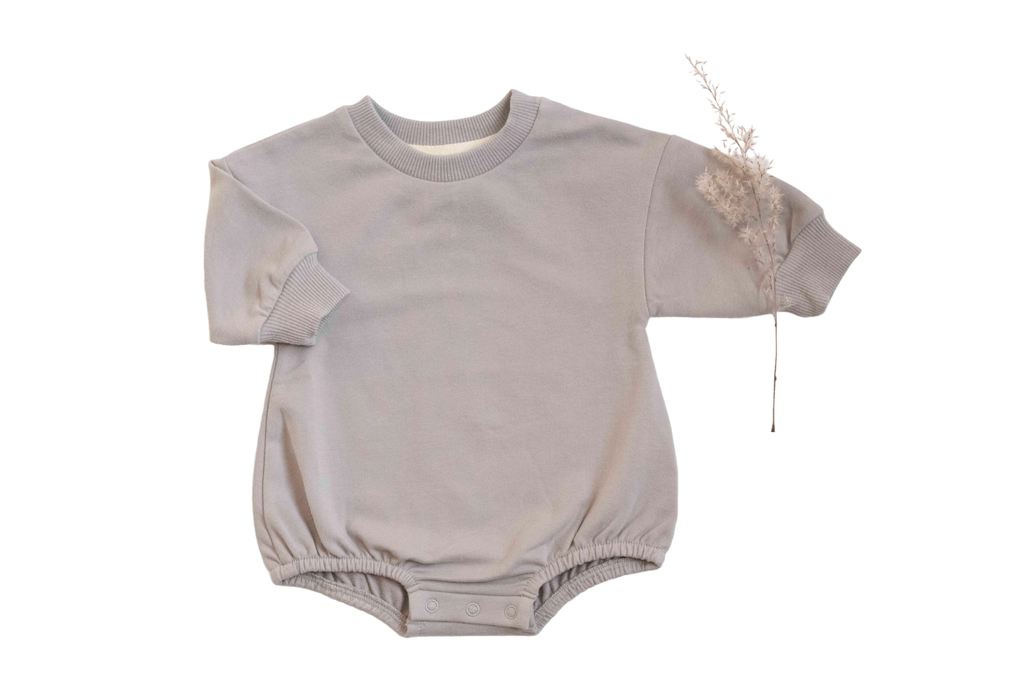 Light gray baby romper with short sleeves on a white background