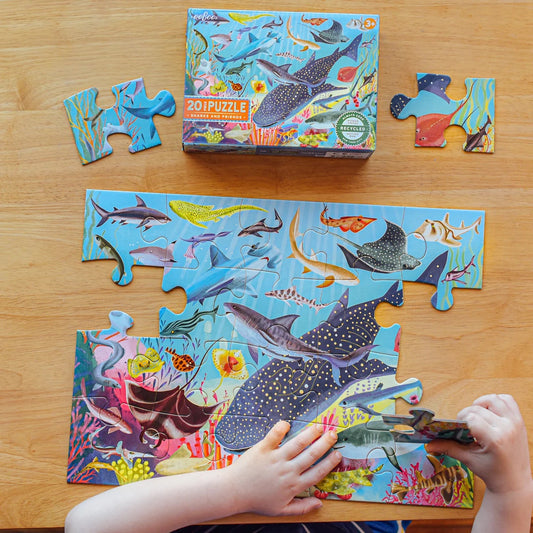 20-piece Sharks & friends puzzle being made on a wooden table