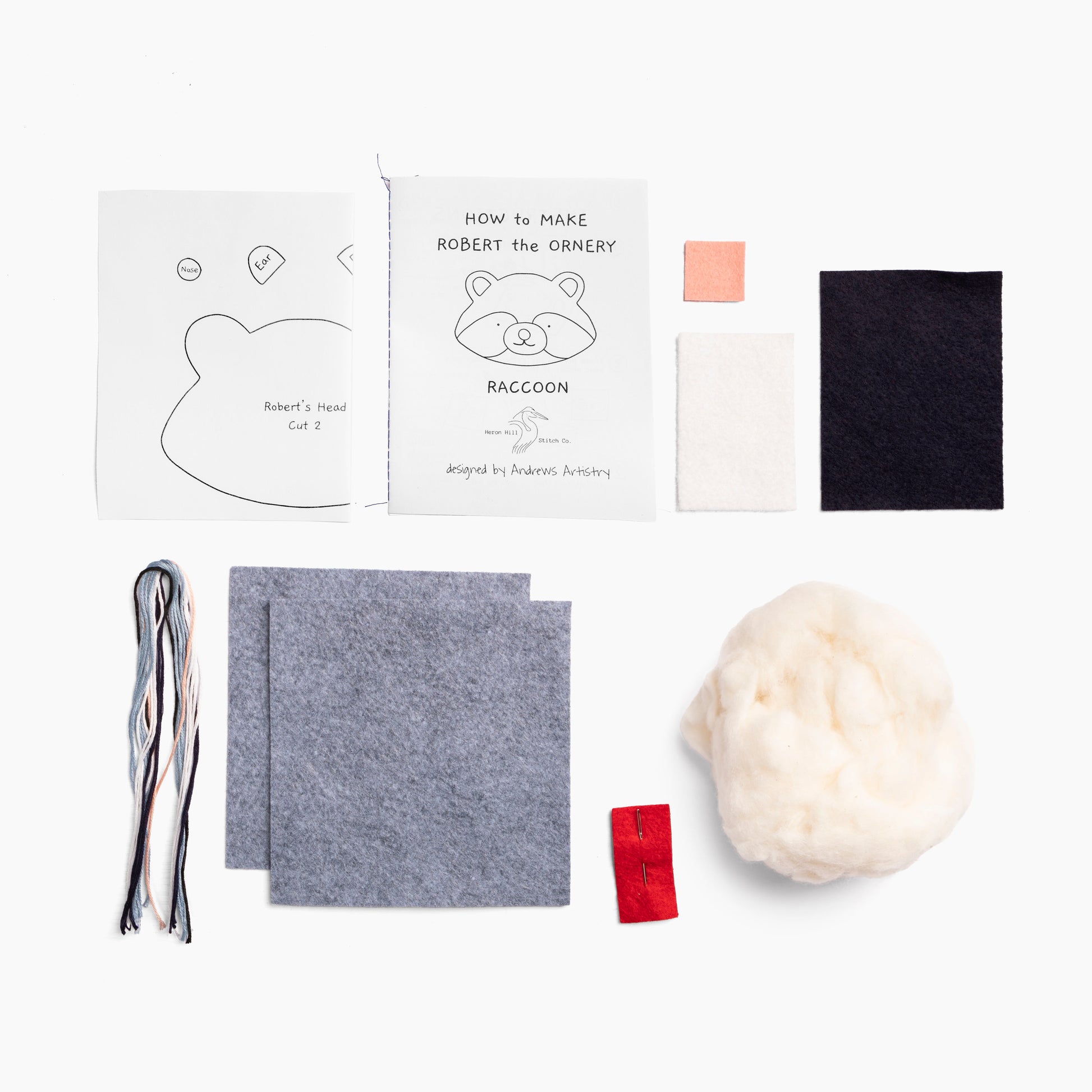Crafting kit components including felt pieces, a template, and yarn on a white background