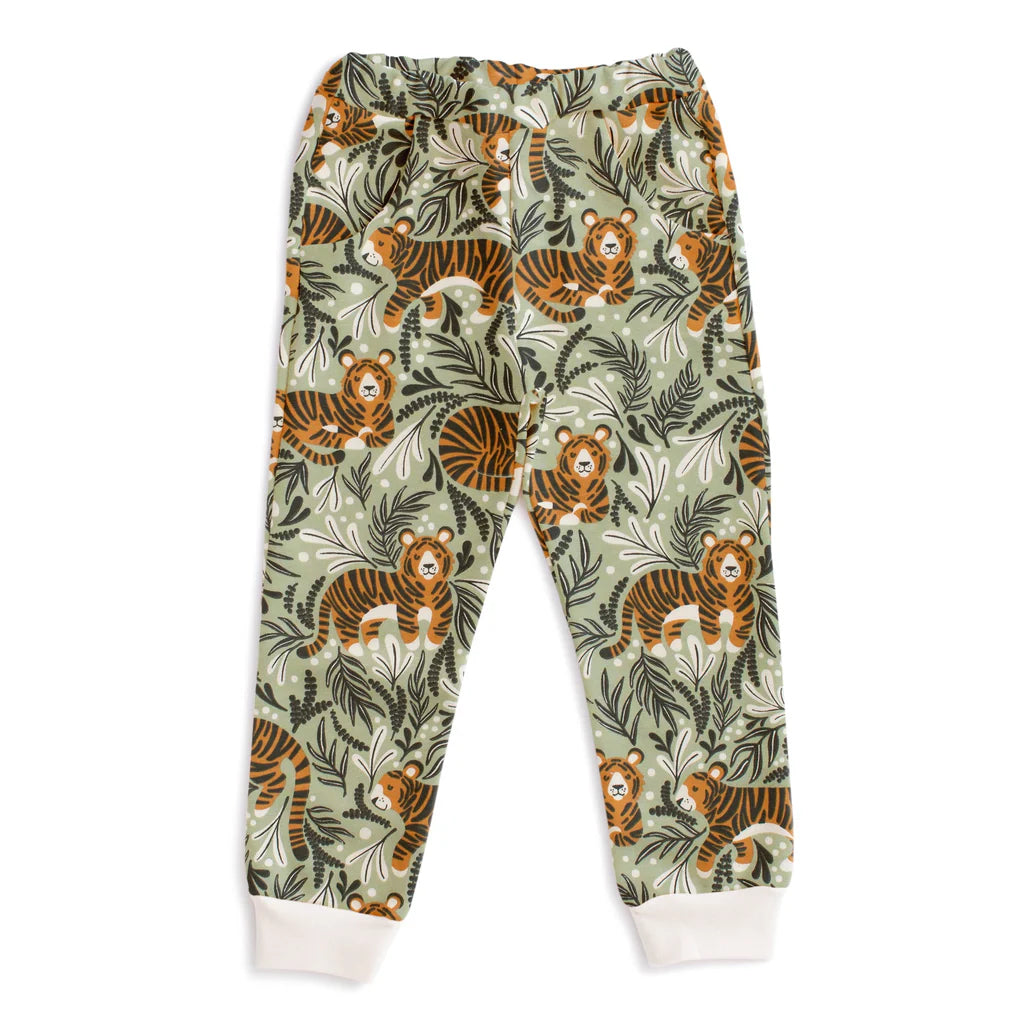 Children's sweatpants with tiger and green leaf pattern on a white background